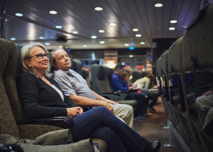 Elderly couple sitting about the ferry