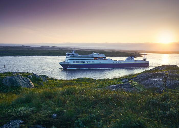 Blue Puttee ship sailing though water during sunrise