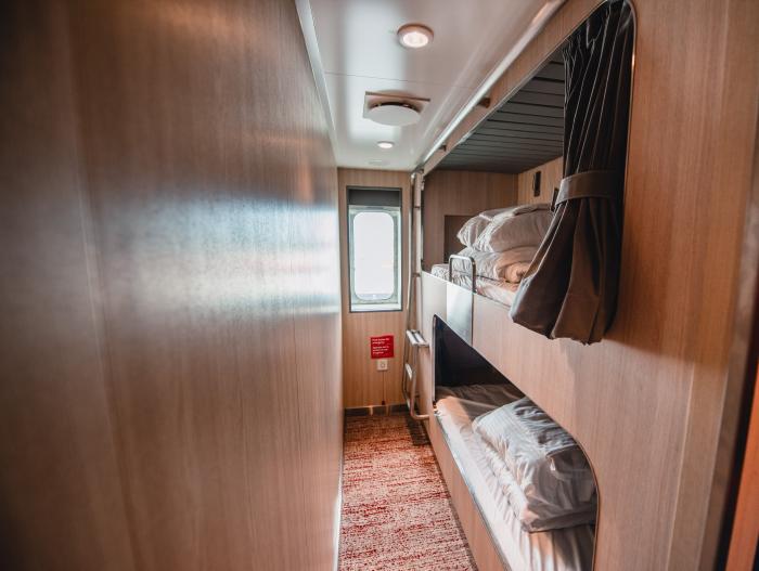 Passenger room with built in bunk beds